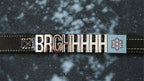 Leather Pawz Please collar with charms spelling BRGHHHHH and a square charm with a snowflake printed on, on a textured black background