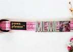 Pink Pawz Please collar with charms spelling MEME and a square charm with a dogs face printed on, on a white background.